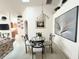 Dining room features a round glass table and wall art at 2511 La Jolla Trl, Kissimmee, FL 34747
