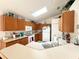 Bright kitchen with wood cabinets and modern appliances at 2511 La Jolla Trl, Kissimmee, FL 34747