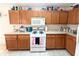 Bright kitchen features ample cabinetry and a gas range at 2511 La Jolla Trl, Kissimmee, FL 34747