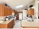 Bright kitchen with oak cabinets and ample counter space at 2511 La Jolla Trl, Kissimmee, FL 34747