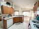 Eat-in kitchen with lots of cabinets and a view to the dining area at 2511 La Jolla Trl, Kissimmee, FL 34747