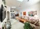Open living room with floral couches and access to dining area at 2511 La Jolla Trl, Kissimmee, FL 34747
