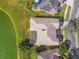 Bird's eye view of the house and its location by the lake at 256 New River Dr, Poinciana, FL 34759