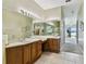 Bathroom features a large vanity with dual sinks, lots of counter space and great lighting at 256 New River Dr, Poinciana, FL 34759