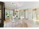 Dining area provides a great space for meals with elegant chandelier at 256 New River Dr, Poinciana, FL 34759