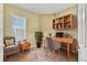Bright home office features built-in shelving and a workspace at 256 New River Dr, Poinciana, FL 34759