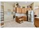 Spacious kitchen offers stainless steel appliances and ample storage with pull out shelving at 256 New River Dr, Poinciana, FL 34759
