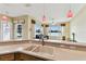 Stylish kitchen is complete with modern appliances and finishes with scenic views at 256 New River Dr, Poinciana, FL 34759
