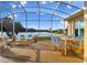 Beautiful screened lanai with lovely lake view, dining and sitting areas with comfortable furniture at 256 New River Dr, Poinciana, FL 34759