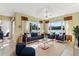 Stylish living room with designer furniture, plush seating, and breathtaking lake views at 256 New River Dr, Poinciana, FL 34759