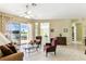 Living room is complete with sliding doors that bring the outside in and invite relaxation at 256 New River Dr, Poinciana, FL 34759