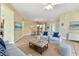 The large living room includes a dining area and is well-decorated with matching decor and furniture at 256 New River Dr, Poinciana, FL 34759