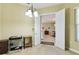 Open office space leading to other rooms, offering a glimpse of the home's layout at 256 New River Dr, Poinciana, FL 34759
