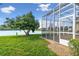 Enjoy the view from this screened patio overlooking the lake at 256 New River Dr, Poinciana, FL 34759