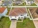 Stunning aerial view of a two-story house with a large yard at 269 Beckenham Dr, Kissimmee, FL 34758