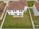 Aerial view of two-story house with backyard and surrounding homes at 269 Beckenham Dr, Kissimmee, FL 34758