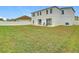 Spacious backyard with grassy area and patio at 269 Beckenham Dr, Kissimmee, FL 34758