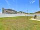 Fenced-in backyard with grassy area and patio at 269 Beckenham Dr, Kissimmee, FL 34758