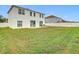 Large backyard with a grassy area and patio at 269 Beckenham Dr, Kissimmee, FL 34758