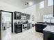 Modern kitchen featuring dark cabinetry, stainless steel appliances, and ample counter space at 269 Beckenham Dr, Kissimmee, FL 34758
