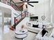 Open living area with high ceilings and a view of the kitchen and staircase at 269 Beckenham Dr, Kissimmee, FL 34758
