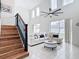 Two-story living room with high ceilings, stylish furniture, and a large window at 269 Beckenham Dr, Kissimmee, FL 34758