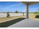 View of backyard features white fence with trees and grass at 1695 Sugarbelle Cir, Mascotte, FL 34753
