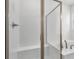 Bathroom featuring a glass enclosed shower with a built-in bench and separate soaking tub at 1695 Sugarbelle Cir, Mascotte, FL 34753