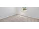 Bedroom featuring neutral carpet, white walls, and a bright window at 1695 Sugarbelle Cir, Mascotte, FL 34753
