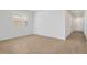 Bright living room with tile floors, white walls, and a large window for natural light at 1695 Sugarbelle Cir, Mascotte, FL 34753
