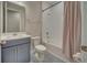 Stylish bathroom featuring a shower-tub combo, patterned tile floor, and modern vanity at 19041 Blueleaf St, Orlando, FL 32827