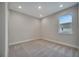 Cozy bedroom with plush carpeting, a bright window, and recessed lighting at 19041 Blueleaf St, Orlando, FL 32827