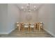 Modern dining room featuring wood-look tile floors and contemporary chandelier at 19041 Blueleaf St, Orlando, FL 32827