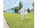 Charming single-story home with lush lawn and whimsical unicorn statue at 19041 Blueleaf St, Orlando, FL 32827