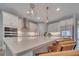 Spacious kitchen with a large island, white countertops, modern appliances, and stylish pendant lighting at 19041 Blueleaf St, Orlando, FL 32827