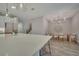 Bright, open kitchen and dining area with stainless steel appliances and stylish light fixtures at 19041 Blueleaf St, Orlando, FL 32827