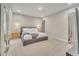 Bright main bedroom with neutral walls, carpet floors, and stylish pendant lighting at 19041 Blueleaf St, Orlando, FL 32827