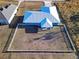 Aerial view of a teal house with a large backyard at 25 Juniper Loop Cir, Ocala, FL 34480