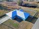 Blue house with metal roof and fenced backyard at 25 Juniper Loop Cir, Ocala, FL 34480