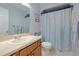Clean bathroom with shower/tub combo and wood vanity at 25 Juniper Loop Cir, Ocala, FL 34480