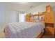 Guest bedroom with a wooden headboard and TV at 25 Juniper Loop Cir, Ocala, FL 34480