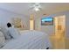 Spacious bedroom with a large TV and en-suite bathroom at 25 Juniper Loop Cir, Ocala, FL 34480