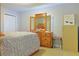 Bright bedroom with a double bed and mirrored dresser at 25 Juniper Loop Cir, Ocala, FL 34480