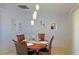 Round dining table with four chairs in a bright dining room at 25 Juniper Loop Cir, Ocala, FL 34480