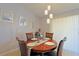Round dining table with four chairs in a bright dining room at 25 Juniper Loop Cir, Ocala, FL 34480
