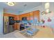 Kitchen with stainless steel appliances and light wood cabinets at 25 Juniper Loop Cir, Ocala, FL 34480