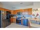 Modern kitchen with stainless steel appliances and wood cabinets at 25 Juniper Loop Cir, Ocala, FL 34480