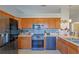 Modern kitchen with stainless steel appliances and wood cabinets at 25 Juniper Loop Cir, Ocala, FL 34480