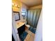 Clean bathroom with a teal shower curtain, and a dark vanity at 2704 Kendall Ave, Kissimmee, FL 34744