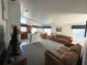 Bright and spacious living room with adjoining kitchen and dining areas at 2981 Kokomo Loop, Haines City, FL 33844